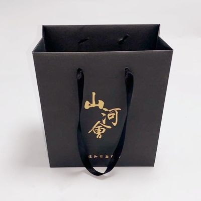 Prezzo buono Acquisto di drogheria dei sacchi di carta di Kraft regalo/del caffè con il logo del bollo della stagnola di oro in linea